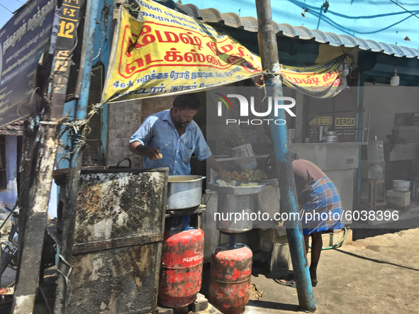 Man selling snacks along the roadside in Kottar, Nagercoil, Tamil Nadu, India on February 12, 2020. 