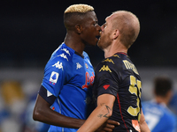 Victor Osimhen of SSC Napoli clashes with Andrea Masiello of Genoa CFC during the Serie A match between SSC Napoli and Genoa CFC at Stadio S...