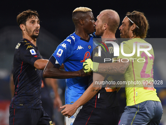 Victor Osimhen of SSC Napoli clashes with Andrea Masiello of Genoa CFC during the Serie A match between SSC Napoli and Genoa CFC at Stadio S...