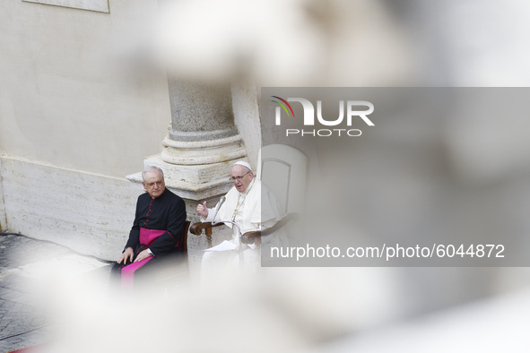 Pope Francis delivers his message during his weekly general audience in the St. Damaso courtyard at the Vatican, Wednesday, Sept. 30, 2020....