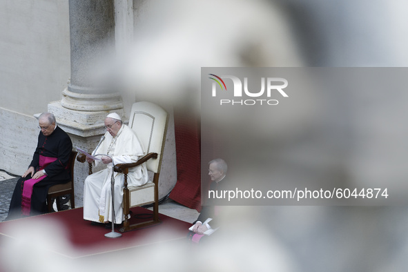 Pope Francis delivers his message during his weekly general audience in the St. Damaso courtyard at the Vatican, Wednesday, Sept. 30, 2020....