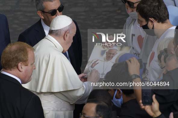 Pope Francis  arrives for his weekly general audience in the St. Damaso courtyard at the Vatican, Wednesday, Sept. 30, 2020. 