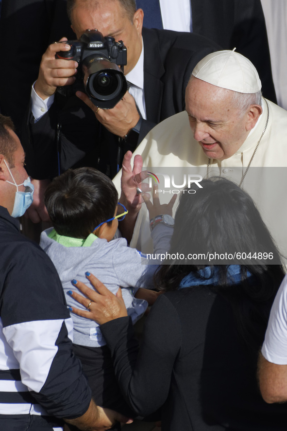 Pope Francis  arrives for his weekly general audience in the St. Damaso courtyard at the Vatican, Wednesday, Sept. 30, 2020. 