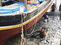 Fisherman in Sungsang, Banyuasin Regency, South Sumatera were repairing their ship on Saturday, September 26, 2020. (