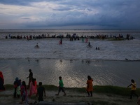 People visiting the riverside as they make their holiday near Dhaka, Bangladesh on October 2, 2020.  (