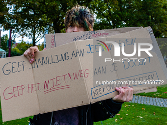 A man is holding a placard, during the students protest for more physical attendance classes, in Amsterdam, Netherlands on October 2nd, 2020...