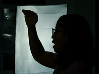 A teacher films online lectures in preparation for the opening of classes at a school in Valenzuela City in Metro Manila, Philippines on Oct...