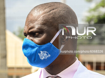 Official of Central Bank of Nigeria wearing a nose mask looks on during the distribution of sensitive electoral materials, which is too dist...