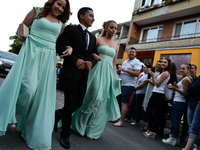 A boy accompanied by two girls is making his way through the crowd of well wishers in the town of Svilengrad, Bulgaria on May 26, 2015 (