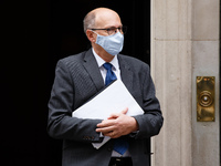 Stephen Powis, National Medical Director of NHS England, wears a face mask leaving 10 Downing Street in London, England, on October 12, 2020...