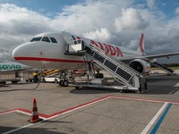 The plane parked at the destination airport. Flying with Lauda Airbus A320 airplane with registration 9H-LMJ during the Covid-19 Coronavirus...