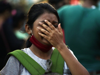A girl reacts in front of a camera and not wearing a mask amid coronavirus emergency in Kolkata, India, 13 October, 2020. India's coronaviru...