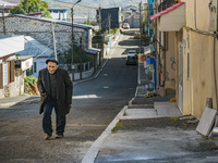 A lonely man walks through the empty streets of Stepanakert, capital of Nagorno Karabakh, by the Azerbaijan shelling on October 13, 2020. (