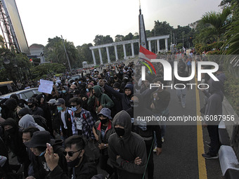 Indonesian student shout a slogan during a demonstration against a new Indonesian labour law passed last week, in Bogor, West Java, October...