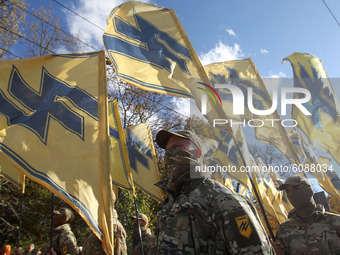 Ukrainians take part in a march to the 78th anniversary of the founding of the Ukrainian Insurgent Army in central Kyiv, Ukraine on 14 Octob...