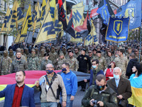 Ukrainians take part in a march to the 78th anniversary of the founding of the Ukrainian Insurgent Army in central Kyiv, Ukraine on 14 Octob...
