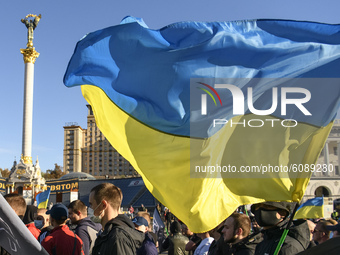 Veterans, activists and supporters of Ukraine's nationalist movements take part in a procession to mark the Defender of Ukraine Day and the...
