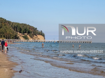 People enjoying last warm days of summer walking, jogging and resting at the Baltic Sea coast near the Orlowski cliff  are seen in Gdynia, P...