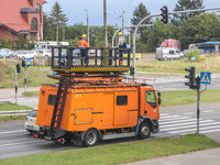 Workers team of fitters repairing trolleybus traction is seen in Gdynia, Poland, on 4 September 2020  (
