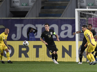 Julian Baumgartlinger of Austria in action against Ionut Mitrita and Nicolae Stanciu of Romania during match against Romania of UEFA Nations...