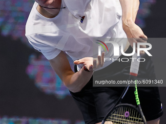 Ugo Humbert of France serves the ball during his ATP St. Petersburg Open 2020 international tennis tournament match against Andrey Rublev of...