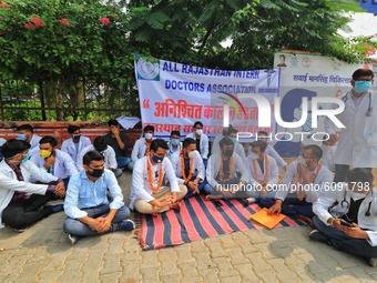 All Rajasthan Intern Doctors Association members sit on the strike outside the SMS Medical College as they protest against the state governm...
