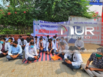 All Rajasthan Intern Doctors Association members sit on the strike outside the SMS Medical College as they protest against the state governm...