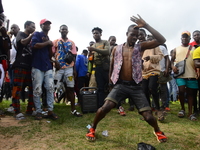 The Youths of End Sars Protesters watch a protester dance during barricade of Lagos - Ibadan expressway, the oldest highway and major link t...
