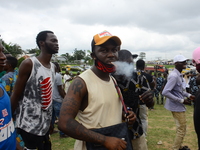An End Sars Protester smoke marijuana during the ongoing barricade of Lagos - Ibadan expressway, the oldest highway and major link to all pa...