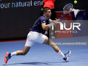 Borna Coric of Croatia returns the ball to Reilly Opelka of United States during their ATP St. Petersburg Open 2020 international tennis tou...
