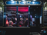 In the Parisian Grands Boulevards district, brasseries and restaurants are changing their opening hours on shop windows as the curfew introd...