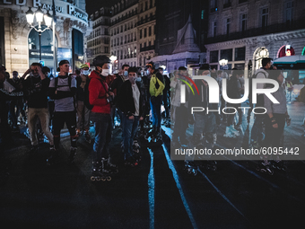 In the Parisian district of the Opéra Garnier, participants in the traditional weekend rollerblade ride are enjoying a last stroll as the cu...