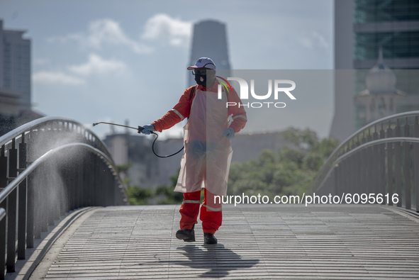 A city hall worker sprays disinfectant at a public park in Kuala Lumpur, Malaysia, on  October 17, 2020. 
Malaysias capital state Kuala Lump...