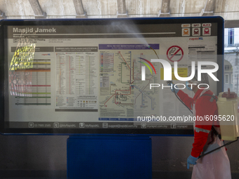 A city hall worker sprays disinfectant at a train station in Kuala Lumpur, Malaysia, on  October 17, 2020. 
Malaysias capital state Kuala Lu...