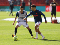 Munir and Carlos Fernandez, of Sevilla FC warms up during the La Liga match between Granada CF and Sevilla FC at Nuevo Los Carmenes Stadium...