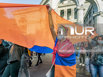 A girl holds a huge armenian flag during a demonstration in Yerevan, Armenia, on October 16, 2020 for the recognition of Nagorno Karabakh as...