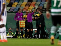 Referee Luis Godinho (C ) shows a red card to Sporting's head coach Ruben Amorim during the Portuguese League football match between Sportin...