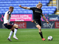 Bolton Wanderers' Ein Doyle and Oldham Athletic's Carl Piergianni in action during the Sky Bet League 2 match between Bolton Wanderers and O...