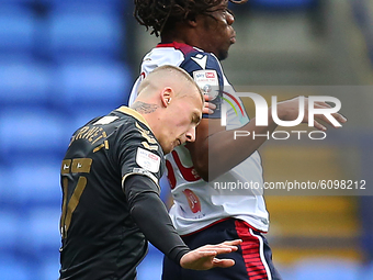  Boltons Peter Kioso clashes with Oldhams Jordan Bernett during the Sky Bet League 2 match between Bolton Wanderers and Oldham Athletic at t...