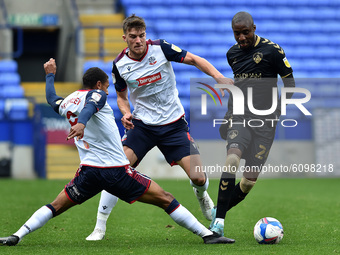 Bolton Wanderers' Brandon Comley ands Oldham Athletic's Dylan Bahamboula in action during the Sky Bet League 2 match between Bolton Wanderer...