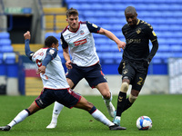 Bolton Wanderers' Brandon Comley ands Oldham Athletic's Dylan Bahamboula in action during the Sky Bet League 2 match between Bolton Wanderer...