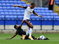 Bolton Wanderers' Brandon Comley and Oldham Athletic's Brice Ntambwe in action during the Sky Bet League 2 match between Bolton Wanderers an...