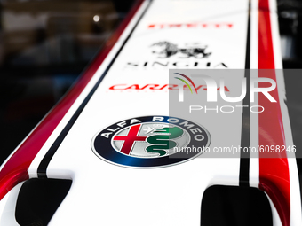 Alfa Romeo logo is seen on the Formula 1 car Sauber C-37 in the livery of Alfa Romeo Racing-Ferrari, in the showcase at a gas station in Kra...