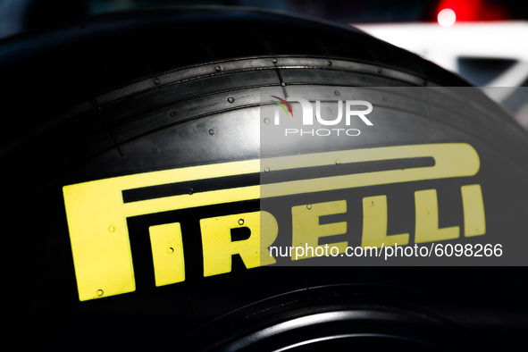 Pirelli logo is seen on a tyre of the Formula 1 car Sauber C-37 in the livery of Alfa Romeo Racing-Ferrari, in the showcase at a gas station...
