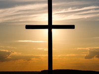 Crucifix is seen during the sunset on The Three Cross Hill in Kazimierz Dolny, Poland on September 3, 2020.  (