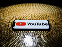 Youtube logo is seen displayed on a phone screen in this illustration photo taken on October 3, 2020. (