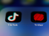 TikTok and Triller apps icons are seen on a phone screen in this illustration photo taken on October 17, 2020. (