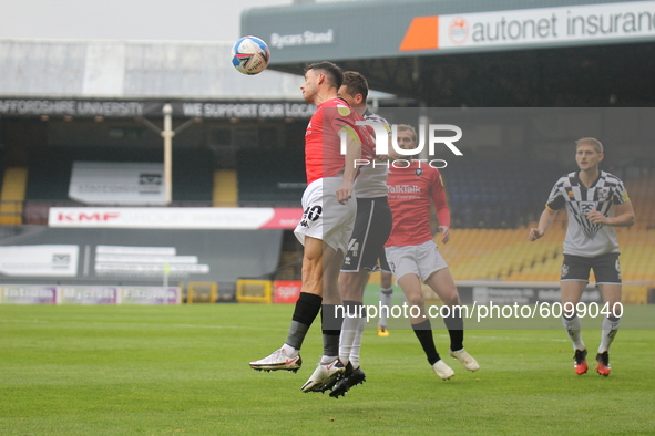Ashley Hunter of Salford City heads the ball during the Sky Bet League 2 match between Port Vale and Salford City at Vale Park, Burslem, Eng...
