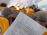 Public Health Covid-19 Passenger Self Declaration Form hold by a passenger inside a Ryanair plane at Burgas airport.
The number of people in...