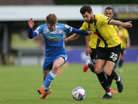 Barrow's Luke James battles for possession with Harrogate Town's  Connor Hall during the Sky Bet League 2 match between Harrogate Town and B...